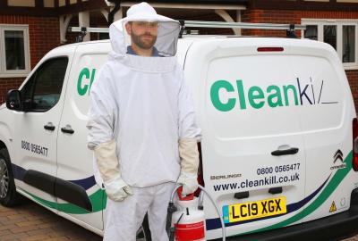 cleankill team member and van